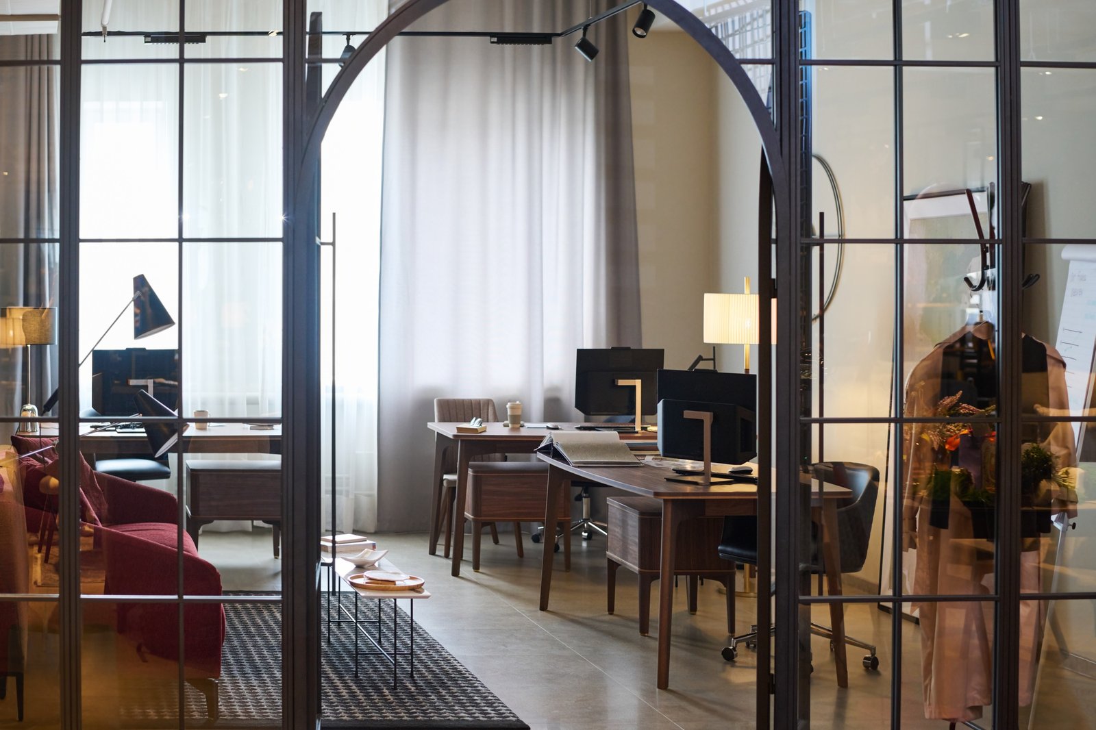 Arch shaped door into small openspace office or coworking area